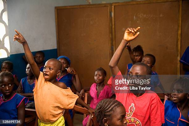 primary school children in class in sierra leone - sierra leone stock pictures, royalty-free photos & images