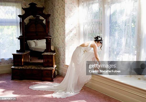 bride getting ready in hotel room - bride getting dressed stock pictures, royalty-free photos & images