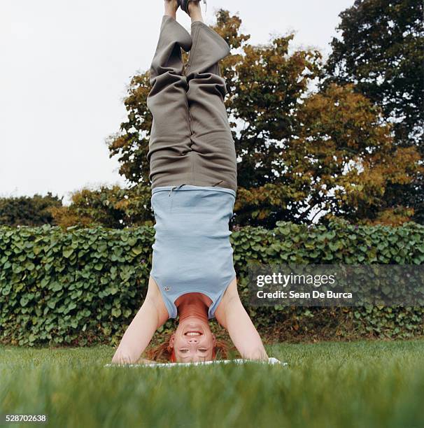 woman doing a handstand - upside down bildbanksfoton och bilder