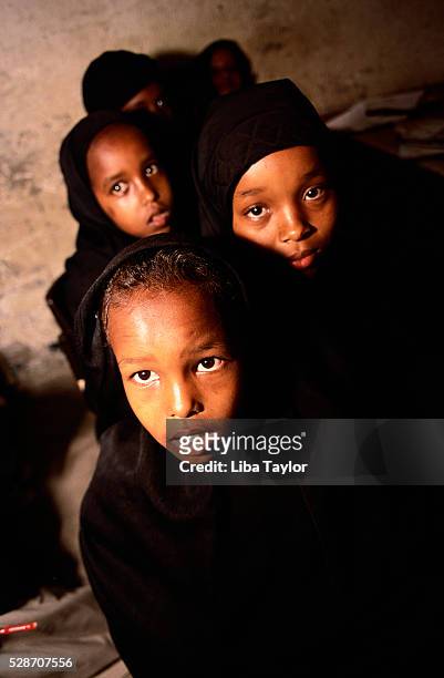 group of young somali schoolgirls in black clothing - hargeisa stock pictures, royalty-free photos & images