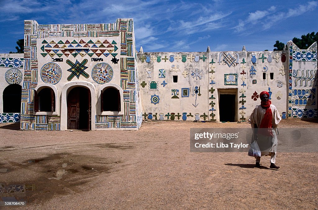 Man Walking Outside Palace