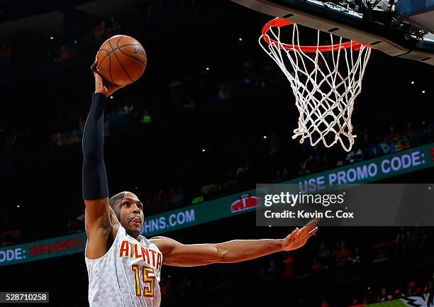 Al Horford of the Atlanta Hawks dunks against Kevin Love of the Cleveland Cavaliers in Game Three of the Eastern Conference Semifinals during the...