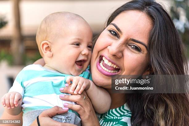 mother and baby - mexican and white baby stock pictures, royalty-free photos & images