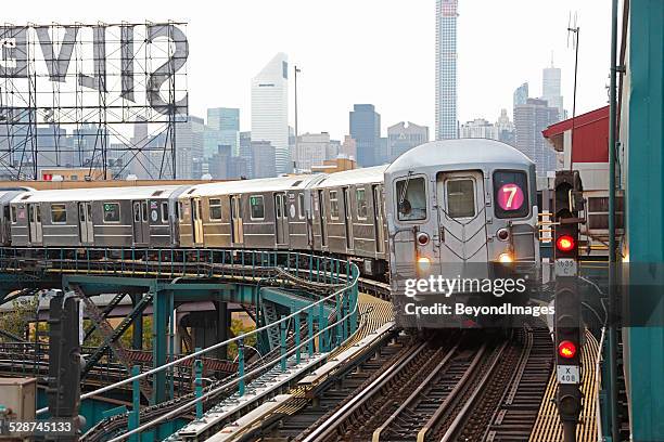 nyc mta subway train on line 7 in queens - number 7 stock pictures, royalty-free photos & images