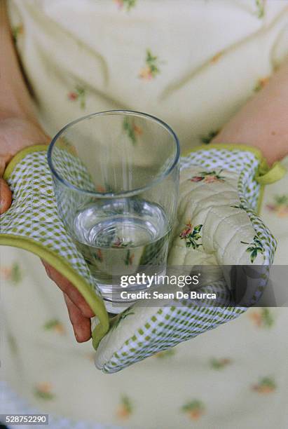 woman holding a glass of water - hot housewives stock pictures, royalty-free photos & images