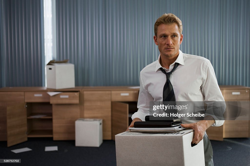 Laid off businessman moving out of office