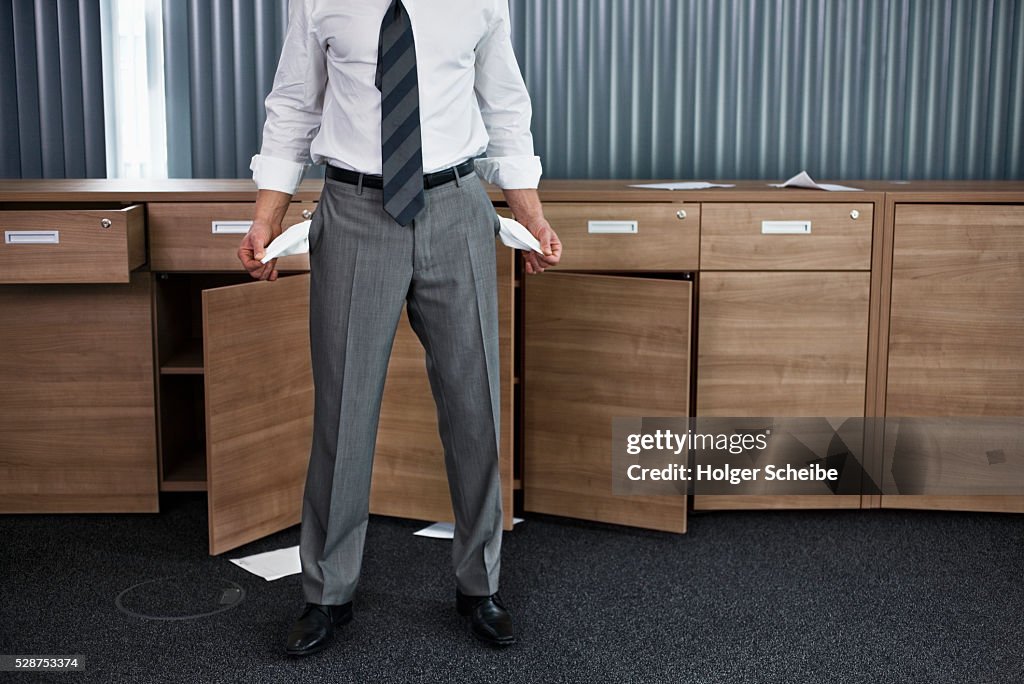 Businessman with empty pockets