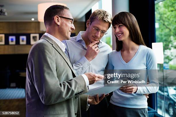 couple making an agreement - real estate investing stock pictures, royalty-free photos & images