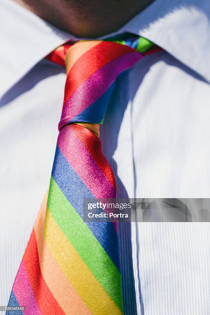 Mid section of man wearing colorful tie gay parade