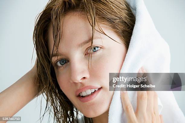 woman drying her hair with a towel - women washing hair stock pictures, royalty-free photos & images