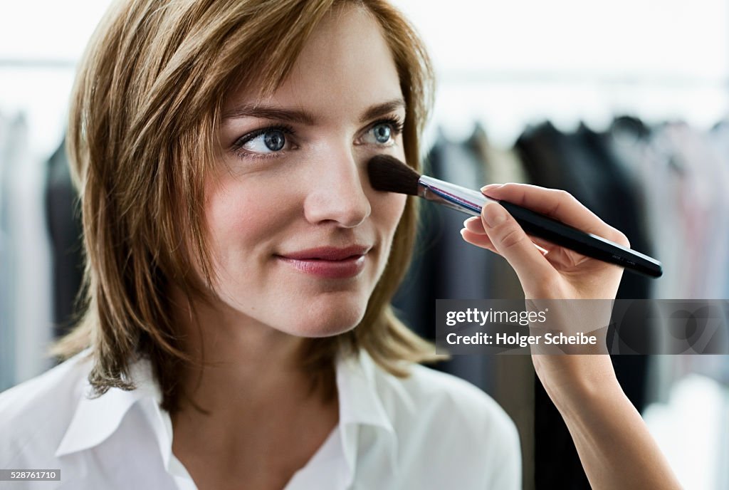 Woman having her makeup done