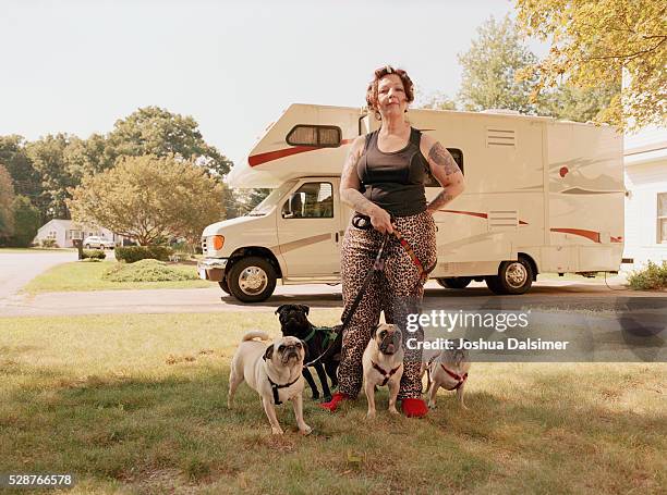 woman with pugs - stereotypical fotografías e imágenes de stock