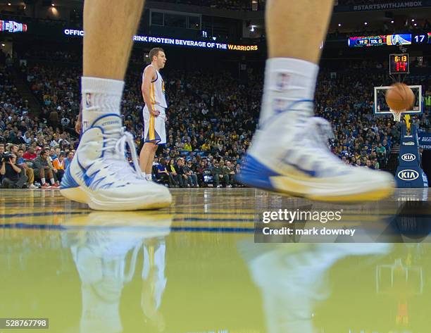 Warrior David Lee seen though players shoes.