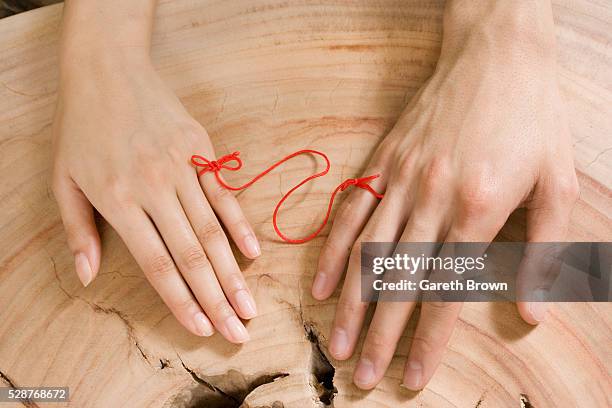 hands of couple tied together - lealdade imagens e fotografias de stock