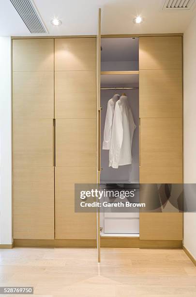 serviced apartment: built-in closet - closet stock pictures, royalty-free photos & images