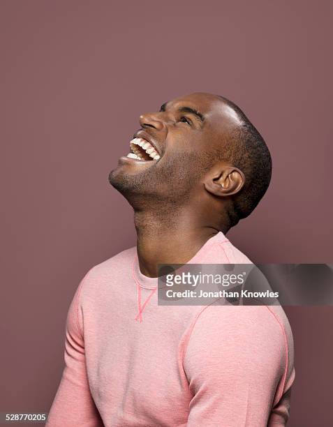 dark skinned looking up, laughing - man mouth open stock pictures, royalty-free photos & images