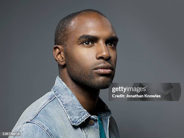 portrait of a dark skinned male - black studio stock pictures, royalty-free photos & images