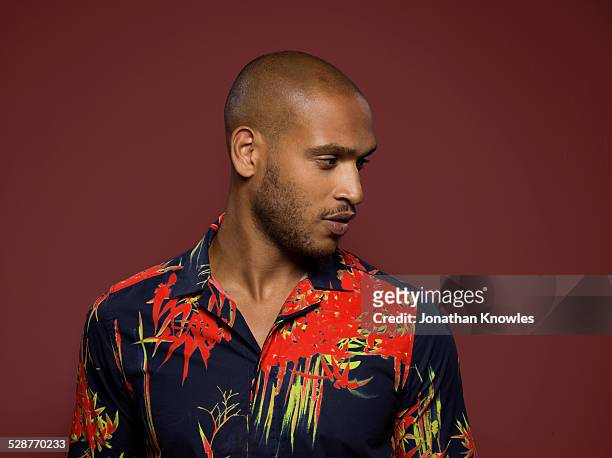 dark skinned male, looking away, bold colours - tshirt stock pictures, royalty-free photos & images