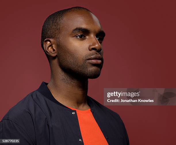 portrait of smiling dark skinned male, side view - short hair men stock pictures, royalty-free photos & images