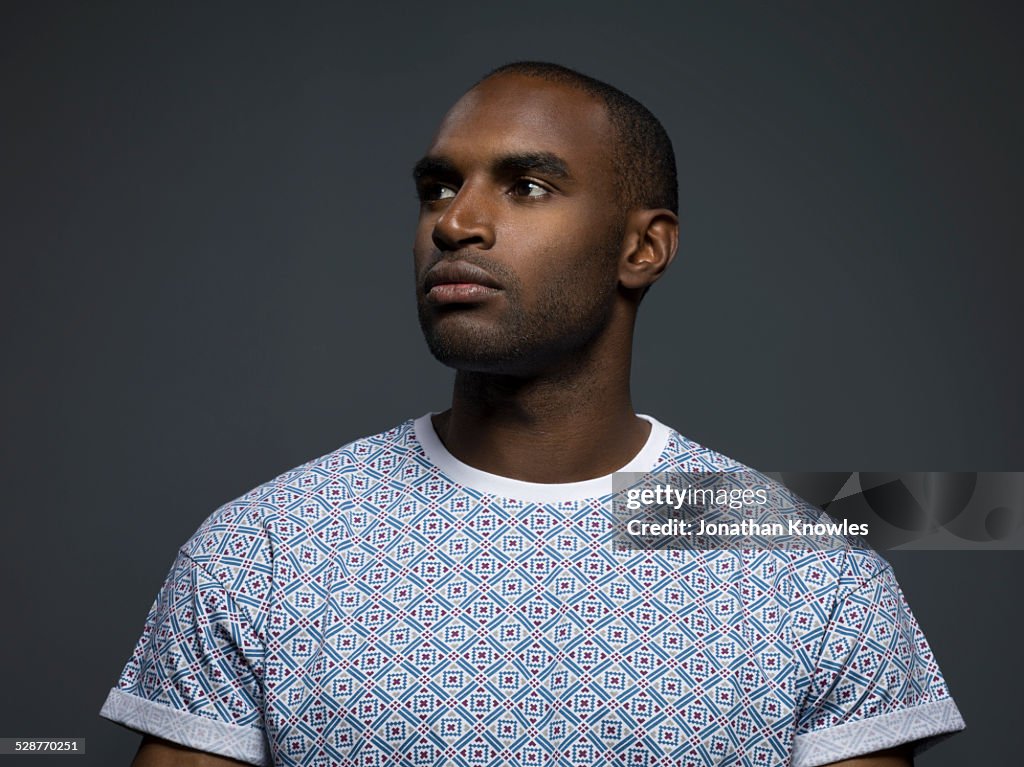 Portrait of a dark skinned male, looking up
