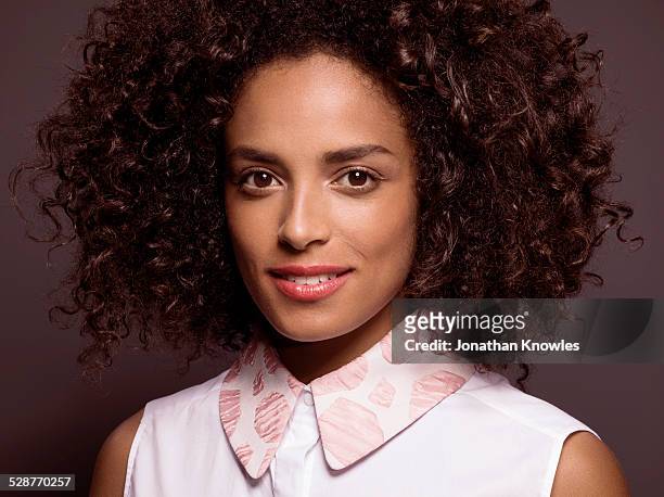 portrait of a dark skinned female smiling - collar stock-fotos und bilder