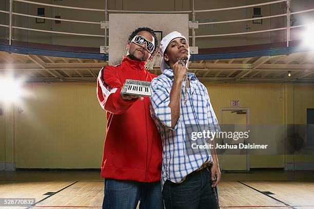 two young men showing bling - toxic masculinity stock pictures, royalty-free photos & images