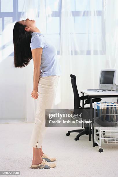 woman stretching - stretching at desk stock pictures, royalty-free photos & images