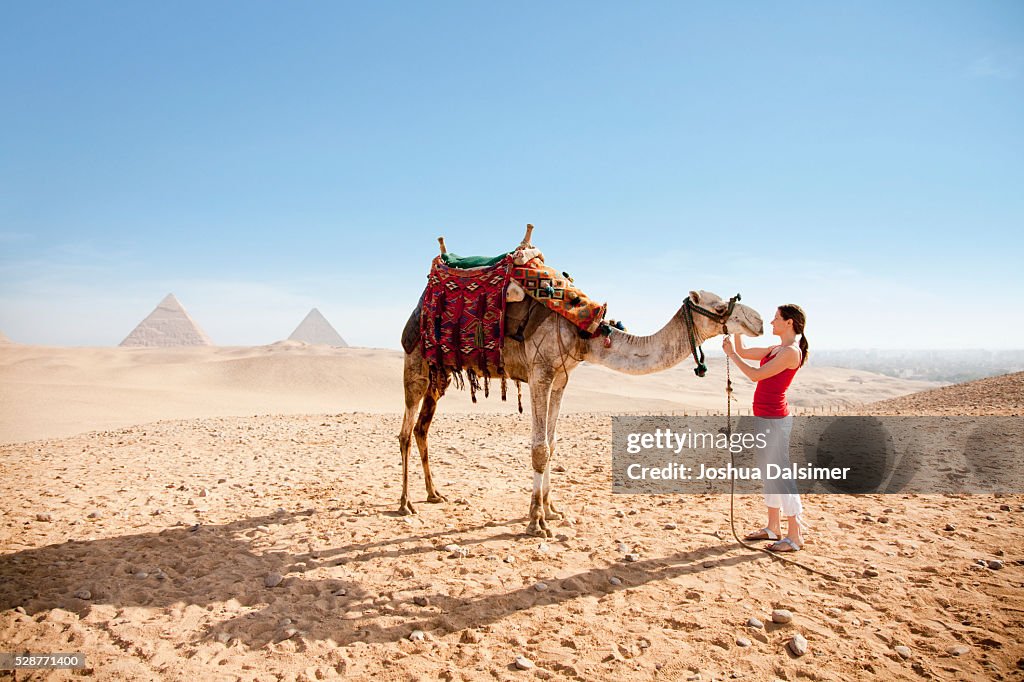 Woman petting a camel