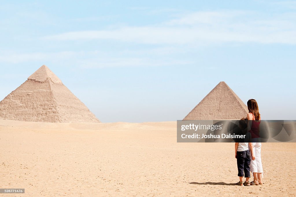 Mother and son looking at pyramids