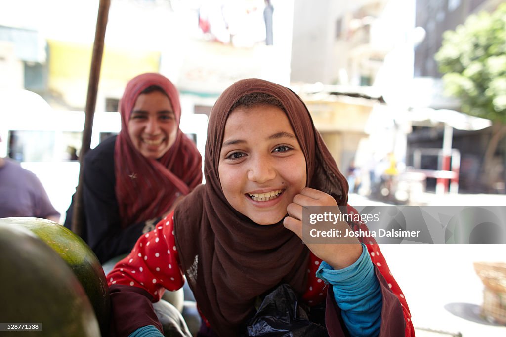 Girls selling melons on the streets of Cairo