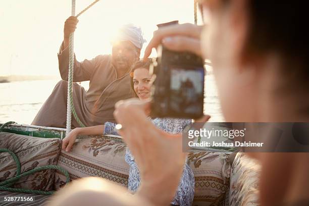 tourists on a boat - north africa photos et images de collection