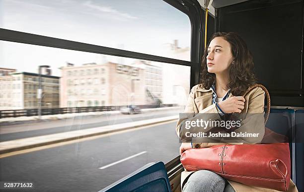 woman riding on a bus - dalsimer foto e immagini stock