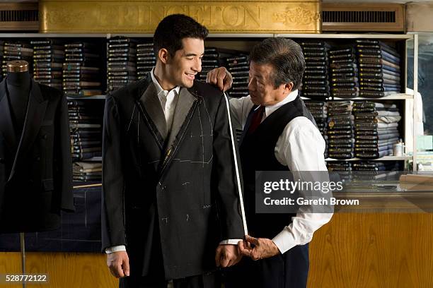 man having custom suit made - sastre fotografías e imágenes de stock