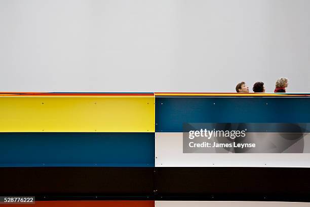 Museum goers walk by Donald Judd's 1989 untitled aluminum sculpture, on view at the Museum of Modern Art in New York City.