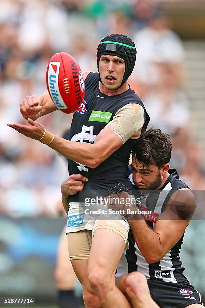 Marc Murphy of the Blues is tackled during the round seven AFL match between the Collingwood Magpies and the Carlton Blues at Melbourne Cricket...