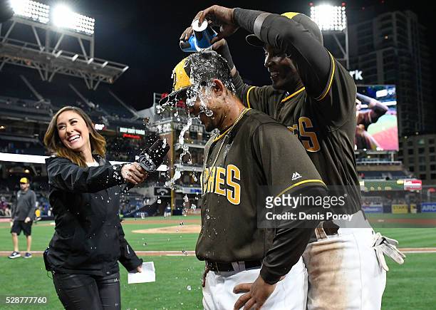 Alexei Ramirez of the San Diego Padres, right, pours water on the head of Jon Jay after the Padres beat the New York Mets 2-0 in a baseball game at...