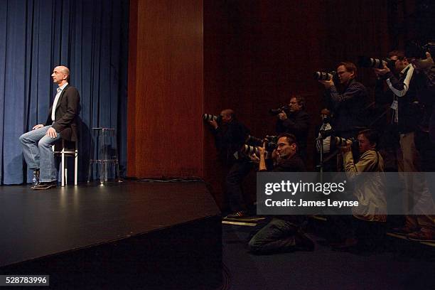 Jeff Bezos, the CEO of Kindle, being photographed by the press while announcing the new Kindle DX electronic book reader. Along with the new device,...