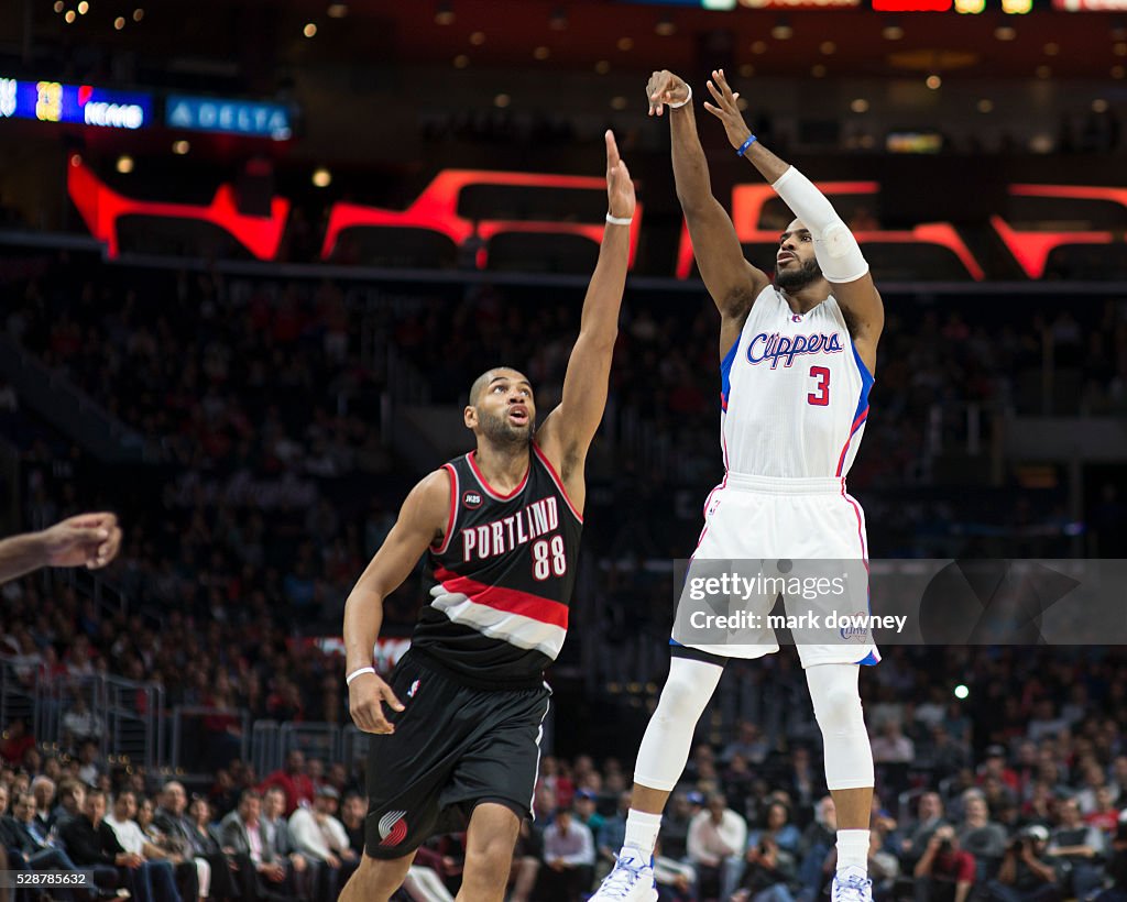 Chris Paul shoots over Blazer Nicolas Batum