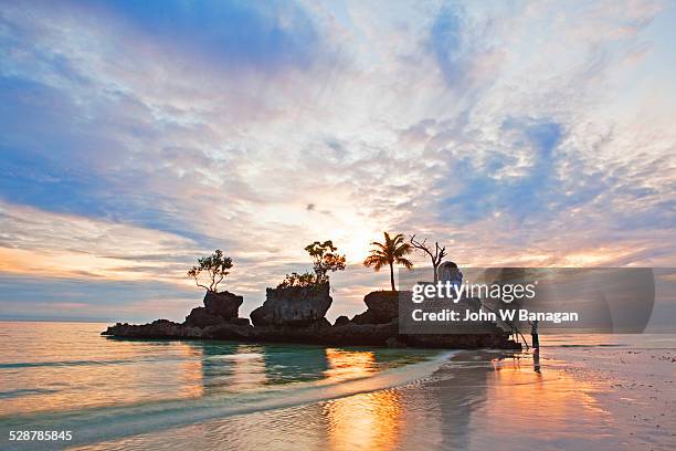 rock formation with shrine. white beach - boracay beach stock pictures, royalty-free photos & images