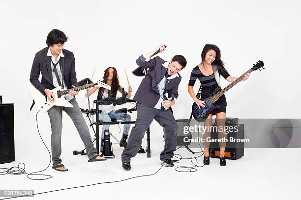 teenagers playing rock music - rockband stockfoto's en -beelden