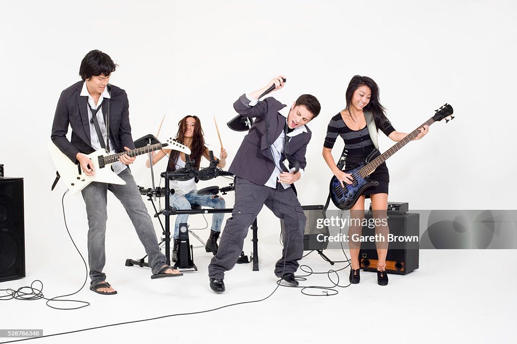 Teenagers playing rock music