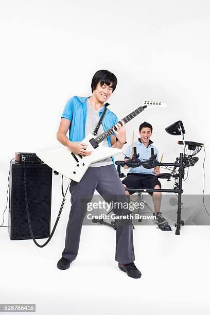 teenagers in a rock band - rock band white background stock pictures, royalty-free photos & images