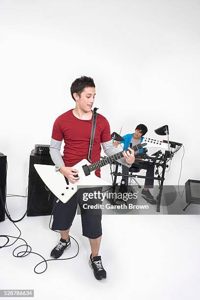 teenagers in a rock band - rock band white background stock pictures, royalty-free photos & images