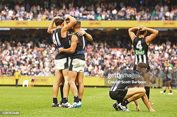 Andrew Walker of the Blues and Levi Casboult of the Blues celebrate on the final siren and winning the round seven AFL match between the Collingwood...