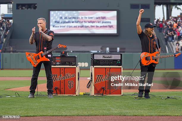 Guitarists James Hetfield and Kirk Hammett of Metallica perform The National Anthem at AT&T Park on May 6, 2016 in San Francisco, California.