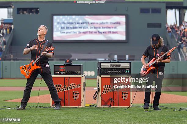 Guitarists James Hetfield and Kirk Hammett of Metallica perform The National Anthem at AT&T Park on May 6, 2016 in San Francisco, California.