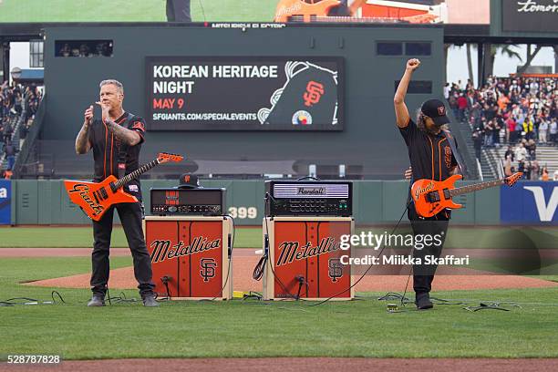 Guitarists James Hetfield and Kirk Hammett of Metallica perform The National Anthem at AT&T Park on May 6, 2016 in San Francisco, California.