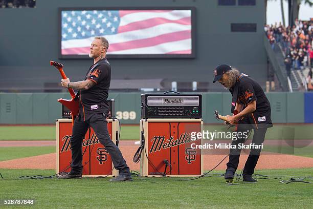 Guitarists James Hetfield and Kirk Hammett of Metallica perform The National Anthem at AT&T Park on May 6, 2016 in San Francisco, California.