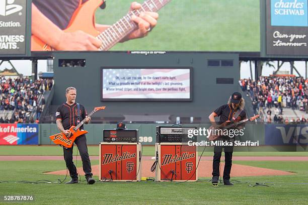 Guitarists James Hetfield and Kirk Hammett of Metallica perform The National Anthem at AT&T Park on May 6, 2016 in San Francisco, California.