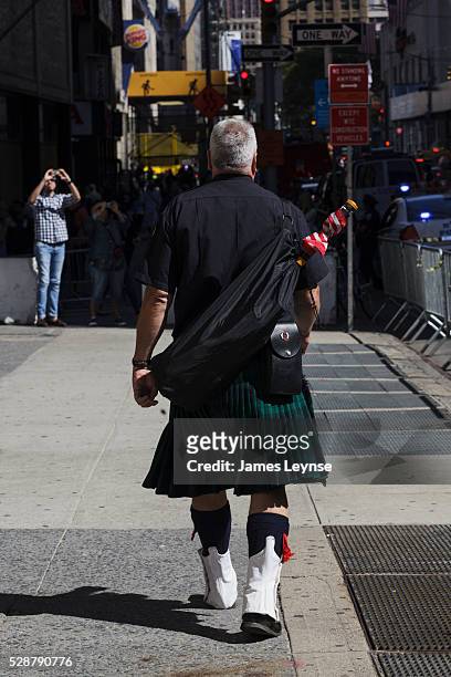 Man wearing a kilt walks near ground zero on the 11th anniversary of the terrorist attacks on 9/11.
